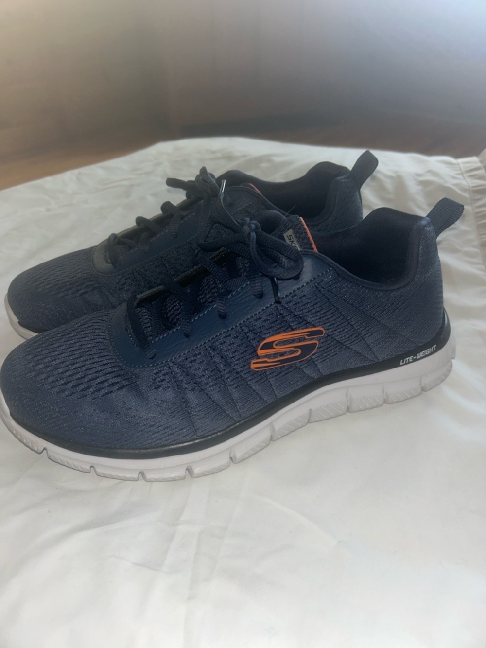 Skechers Men's Navy Athletic Sneakers with Orange Logo Accent